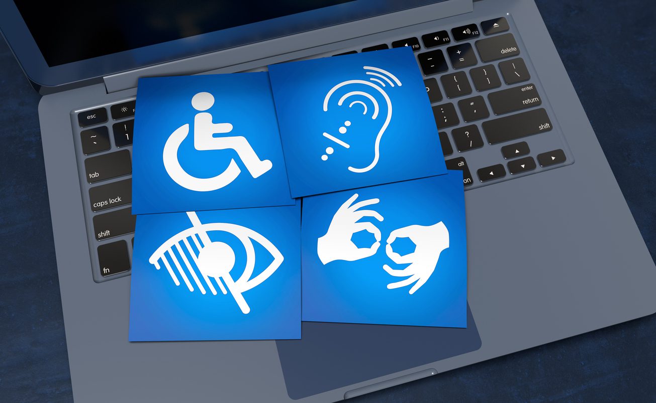 Blue disability icons on a keyboard.