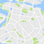 A decorative map of a nonspecific city showing roads and green areas showing parks.